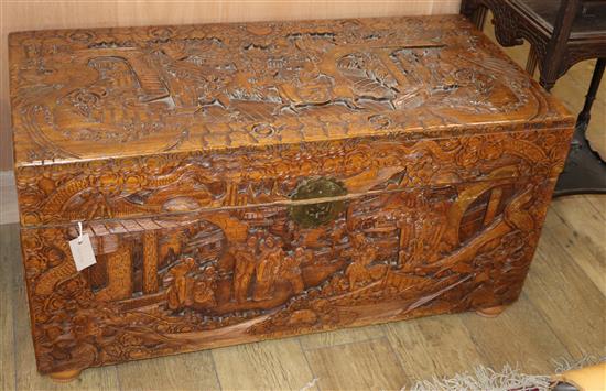 A Chinese carved camphorwood trunk L.105cm